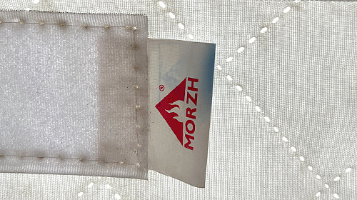 The authentic MORZH bathhouse tent has a nameplate with a logo and data The authentic MORZH bathhouse tent has a nameplate with a logo and data